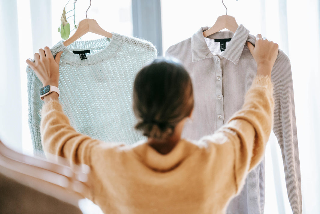 woman browsing articles of clothing