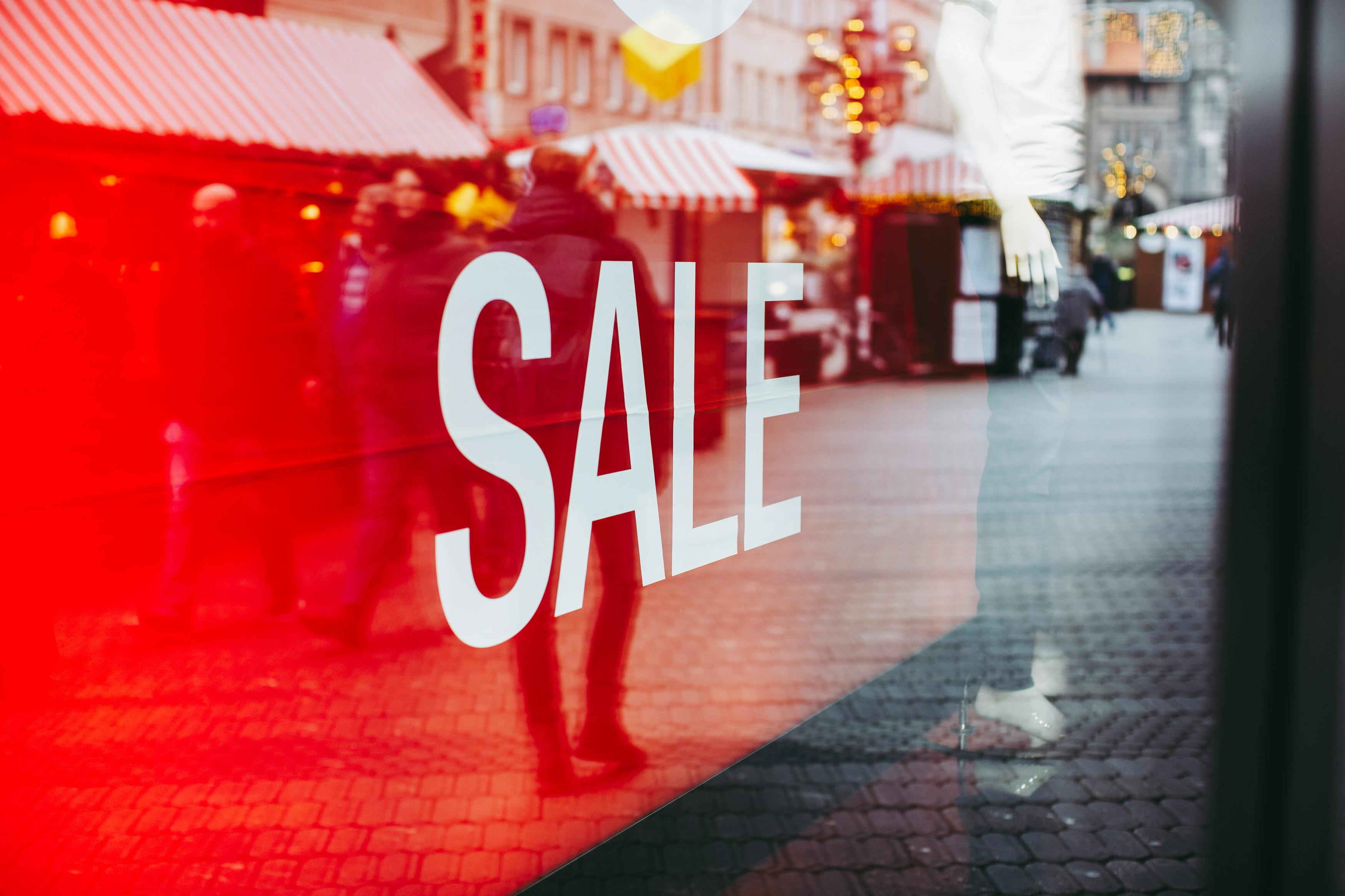 a sale sign in a shop window