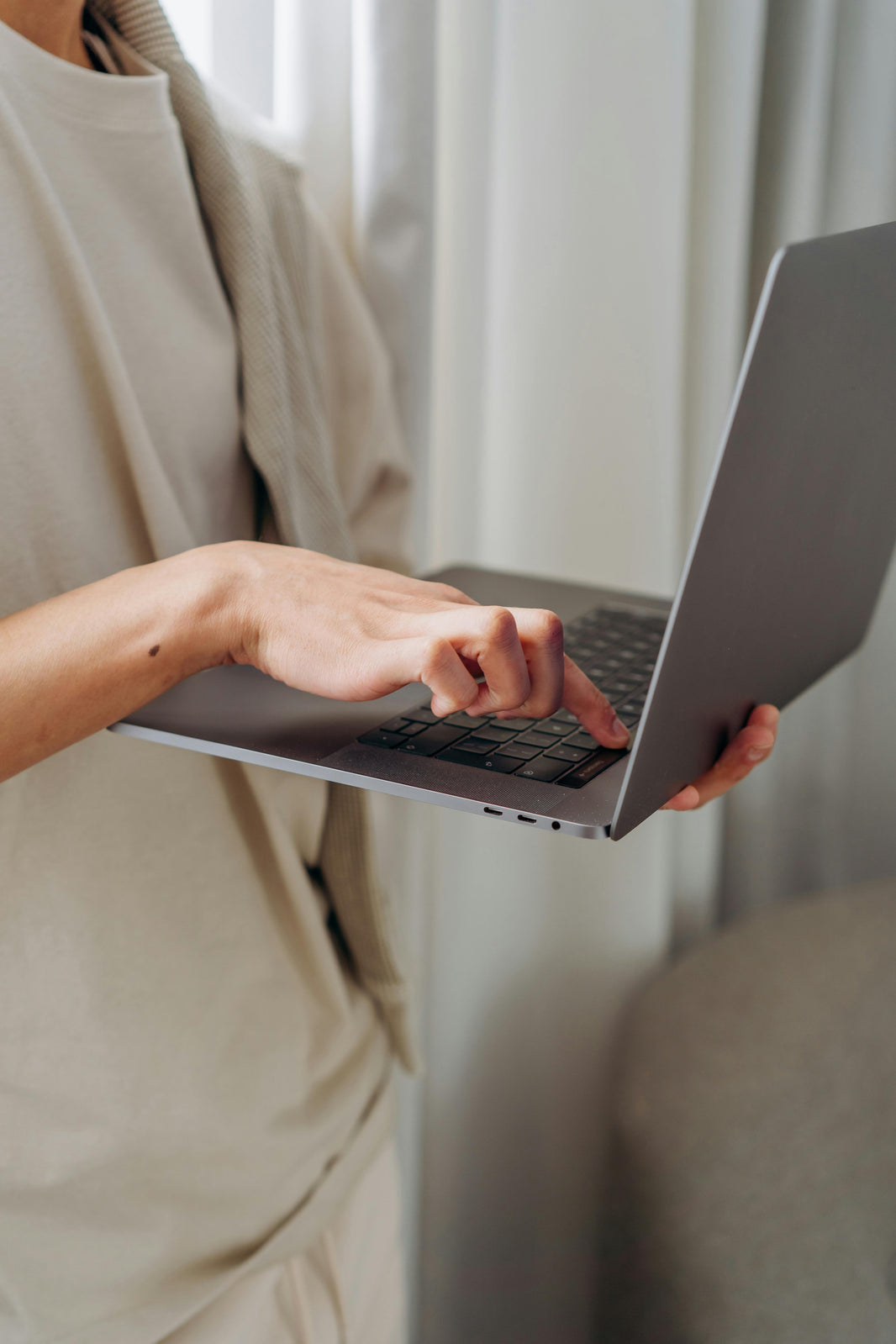 typing on laptop
