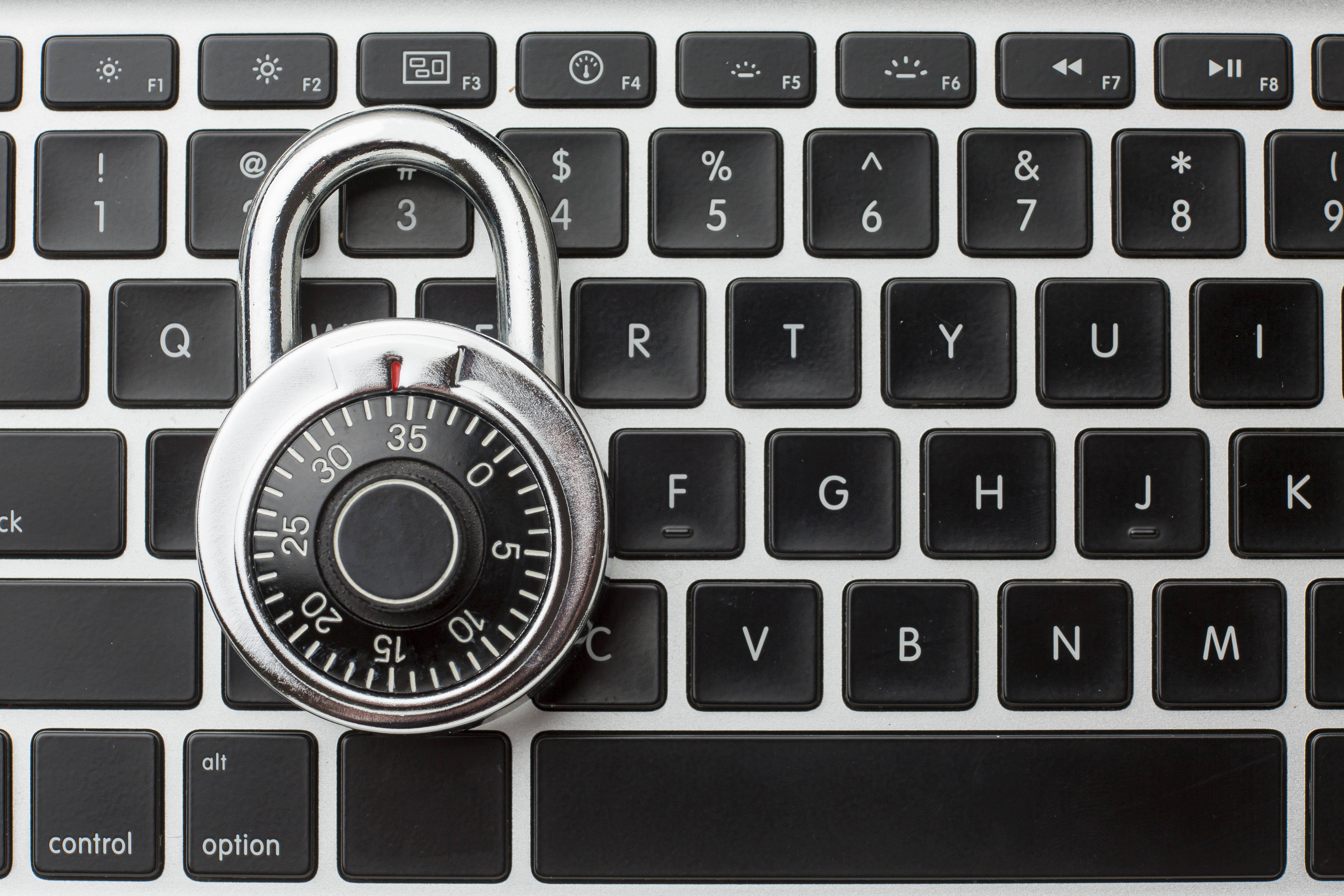 padlock resting on computer keyboard