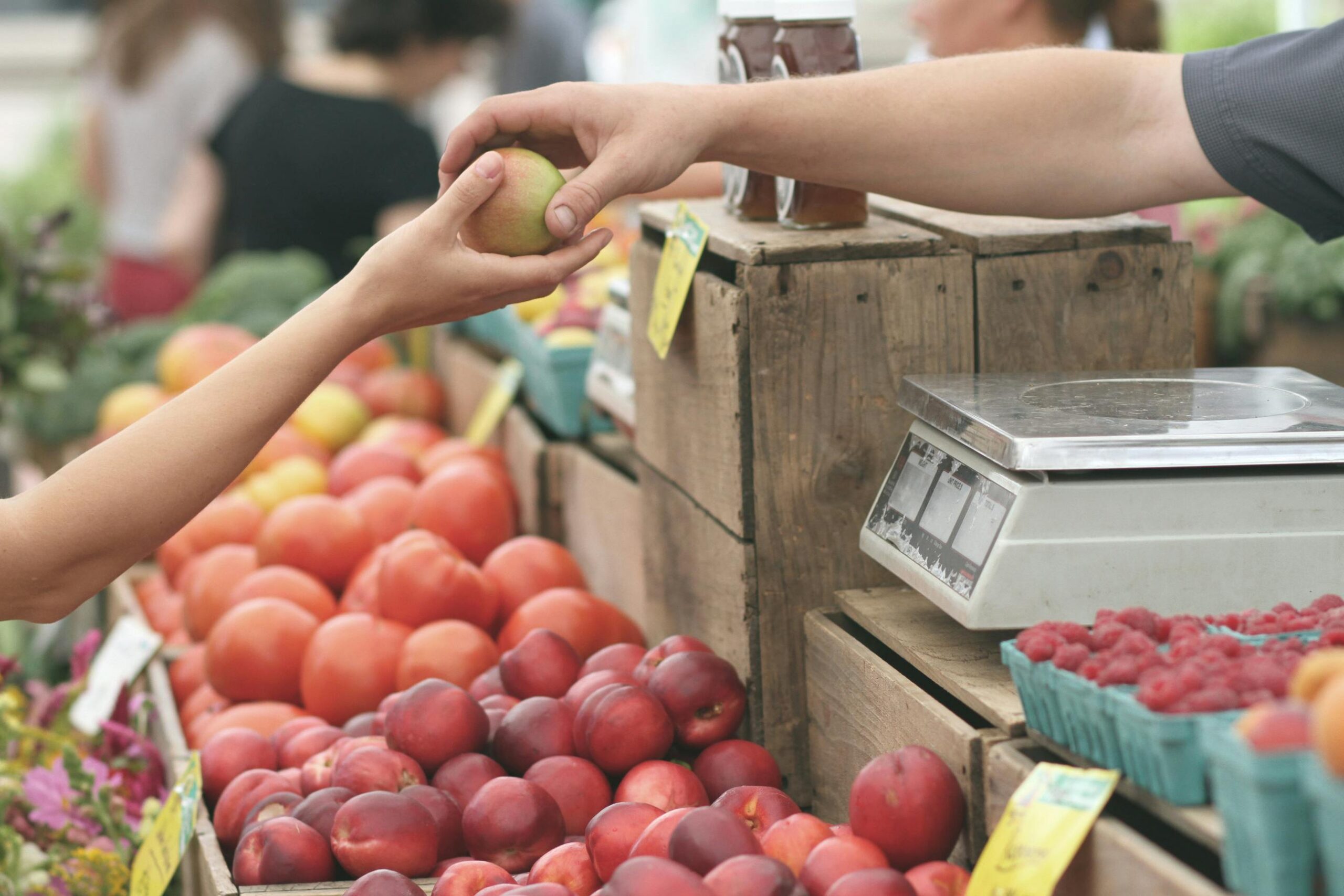 customer handing an apple