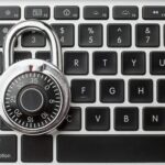 padlock resting on computer keyboard