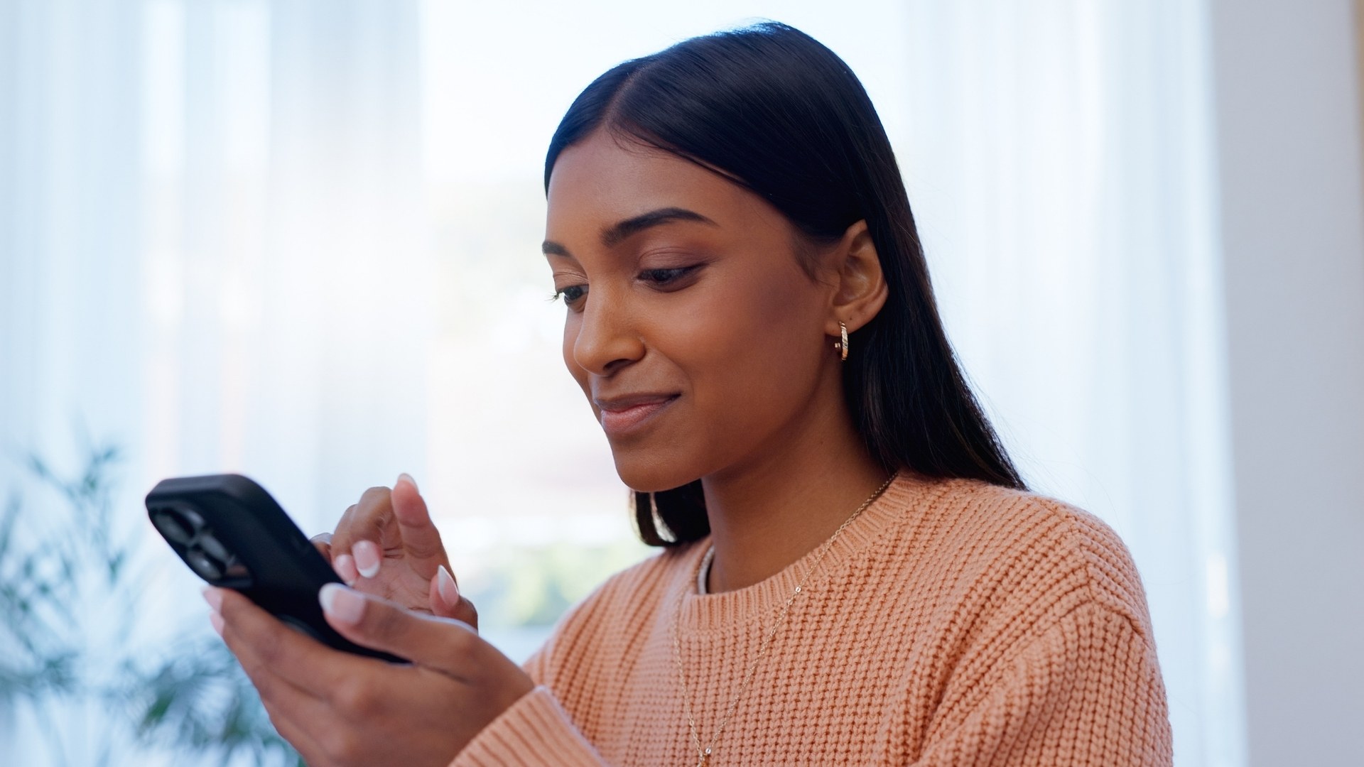 Woman checking email on phone
