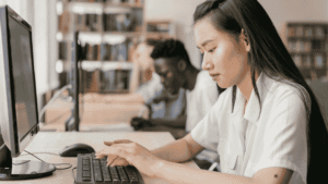 woman typing on computer