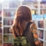 student shopping at bookstore