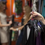 woman holding clothing