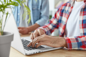 two men using laptop