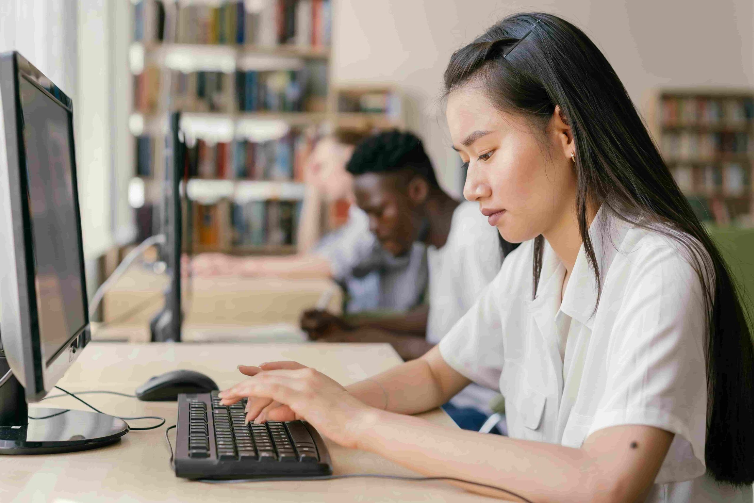 woman typing on computer