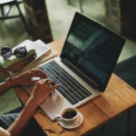 woman typing on laptop