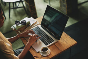 woman typing on laptop