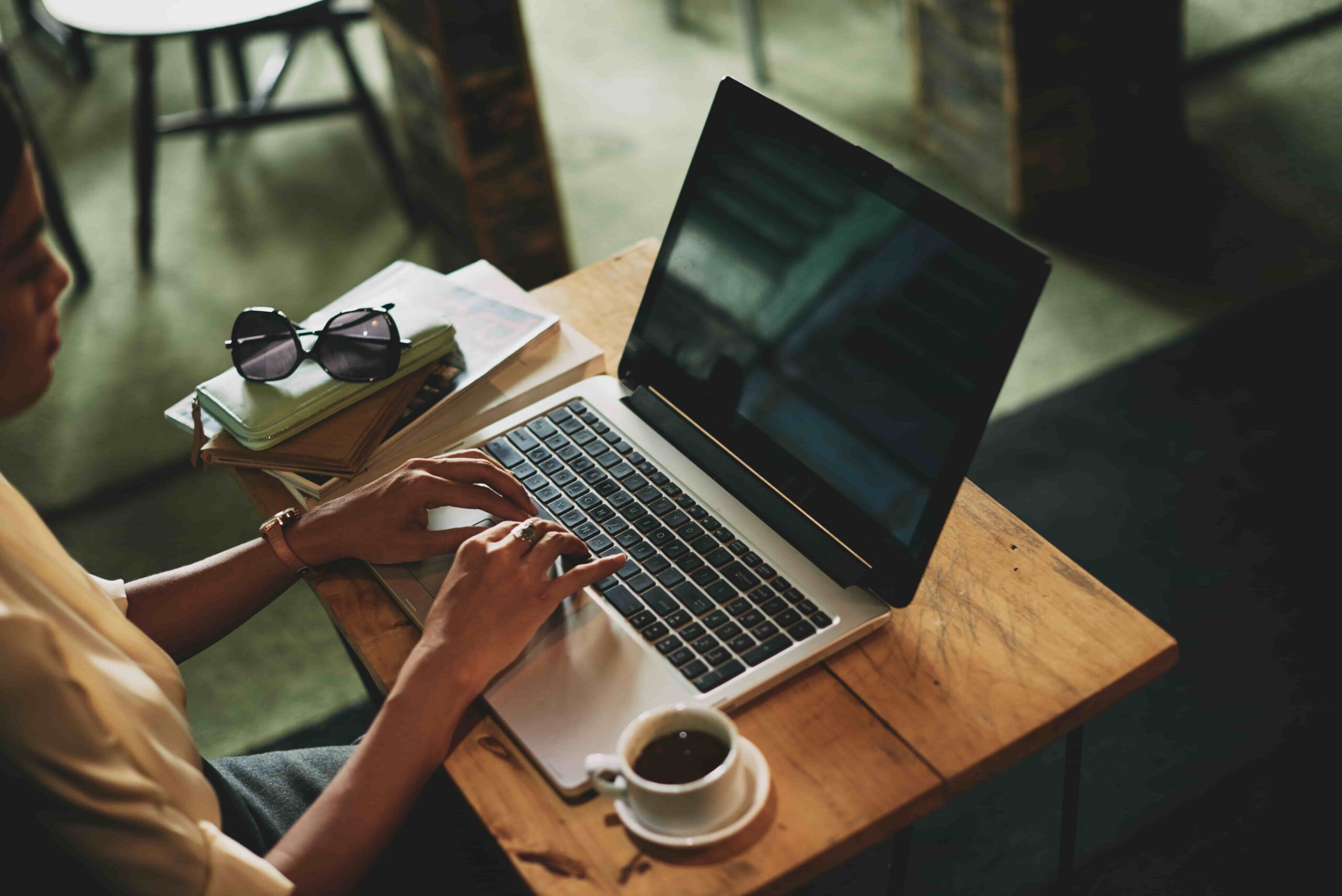 woman typing on laptop